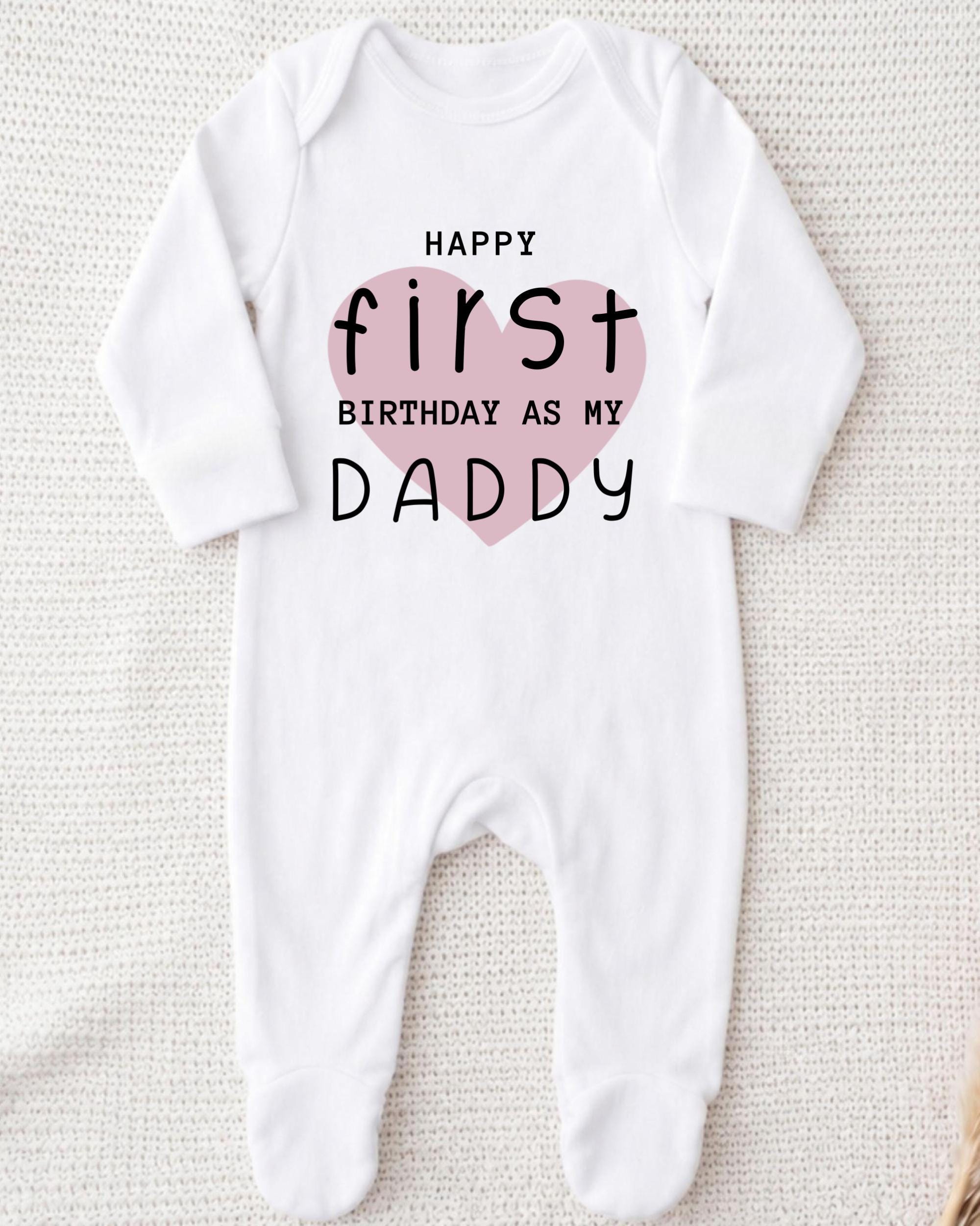 A white onesie with a printed message on it.