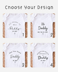 four white t-shirts with black text and graphics, each with a different message related to the concept of a "Daddy" or a "Daddy in the future".