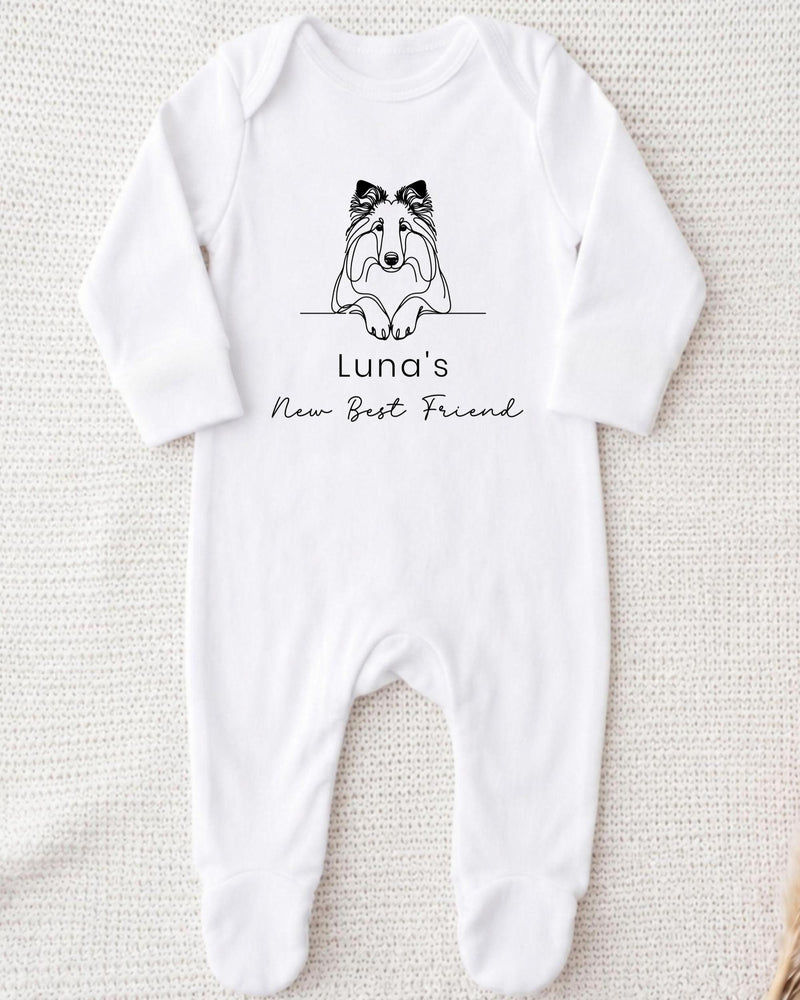 A white bodysuit with a black graphic of a dog and the text "Luna's New Best Friend" printed on it.
