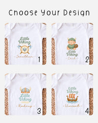 four different baby onesies with the name "Little Viking" printed on them.