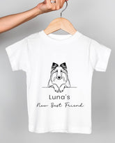 A white t-shirt with a black graphic design of a dog's head and the text "Luna's New Best Friend" printed on it.