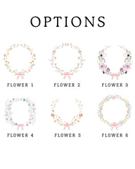 six floral wreaths of different sizes and colors, each with a unique design and arrangement of flowers.