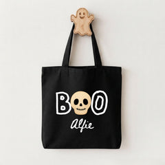 A black tote bag with the text "BOO ALFIE" printed on it, along with a skull graphic.
