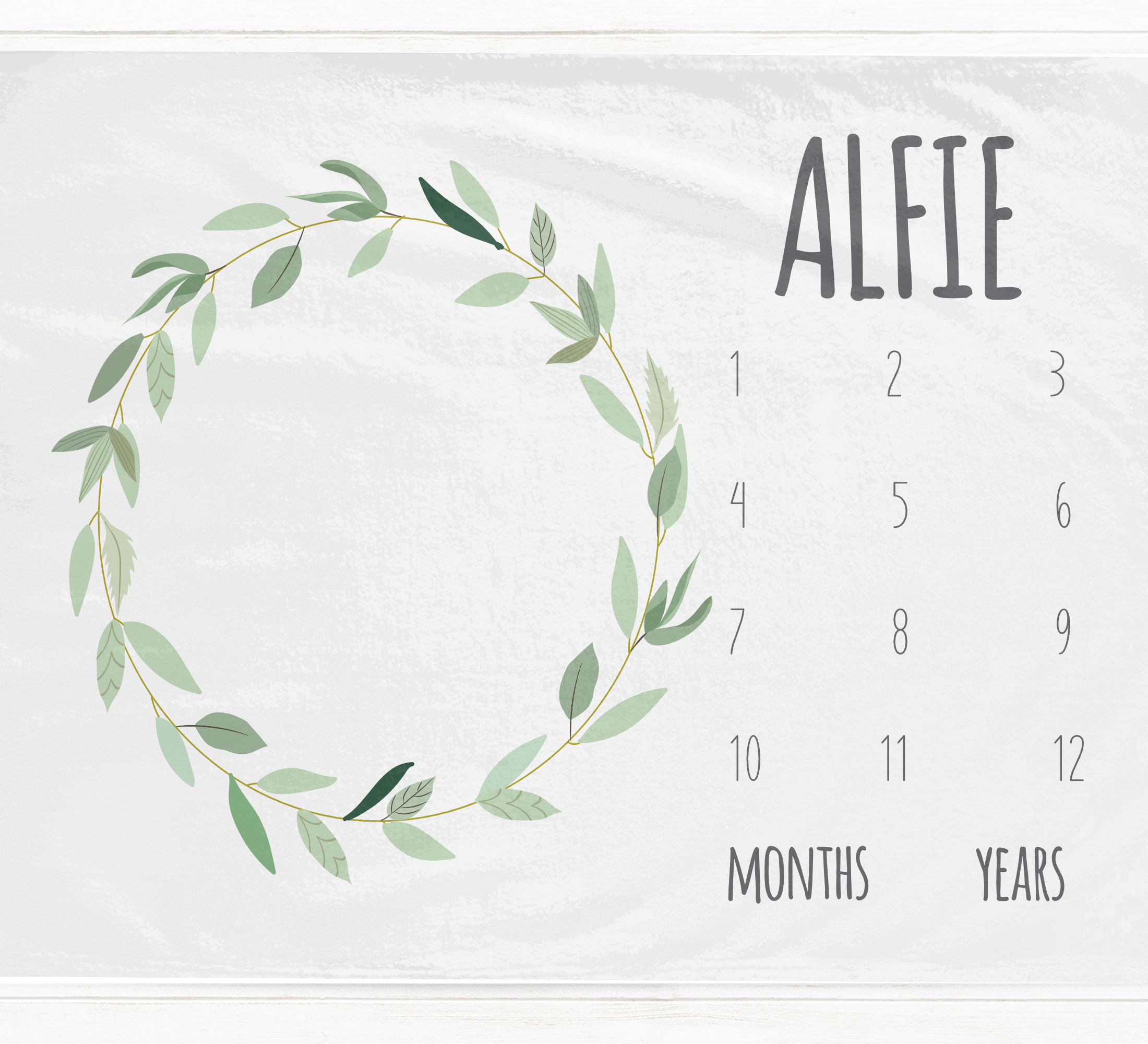 a calendar with a wreath of leaves on it