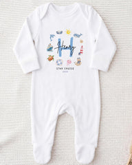 A white onesie with a personalized name and a "STAR CRUISE" text printed on it.