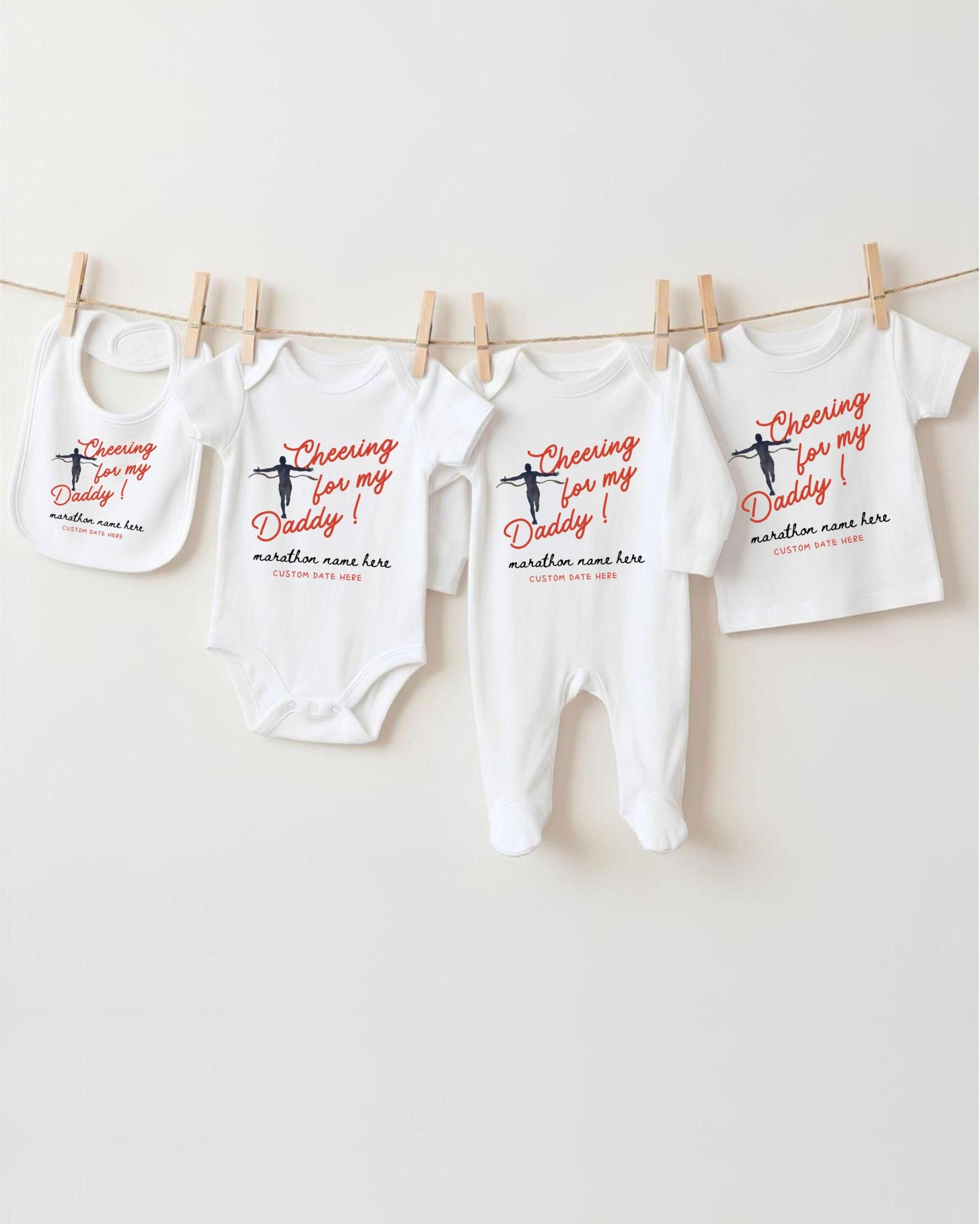 a collection of baby clothes hanging on a clothesline, with each piece featuring a unique design and text.