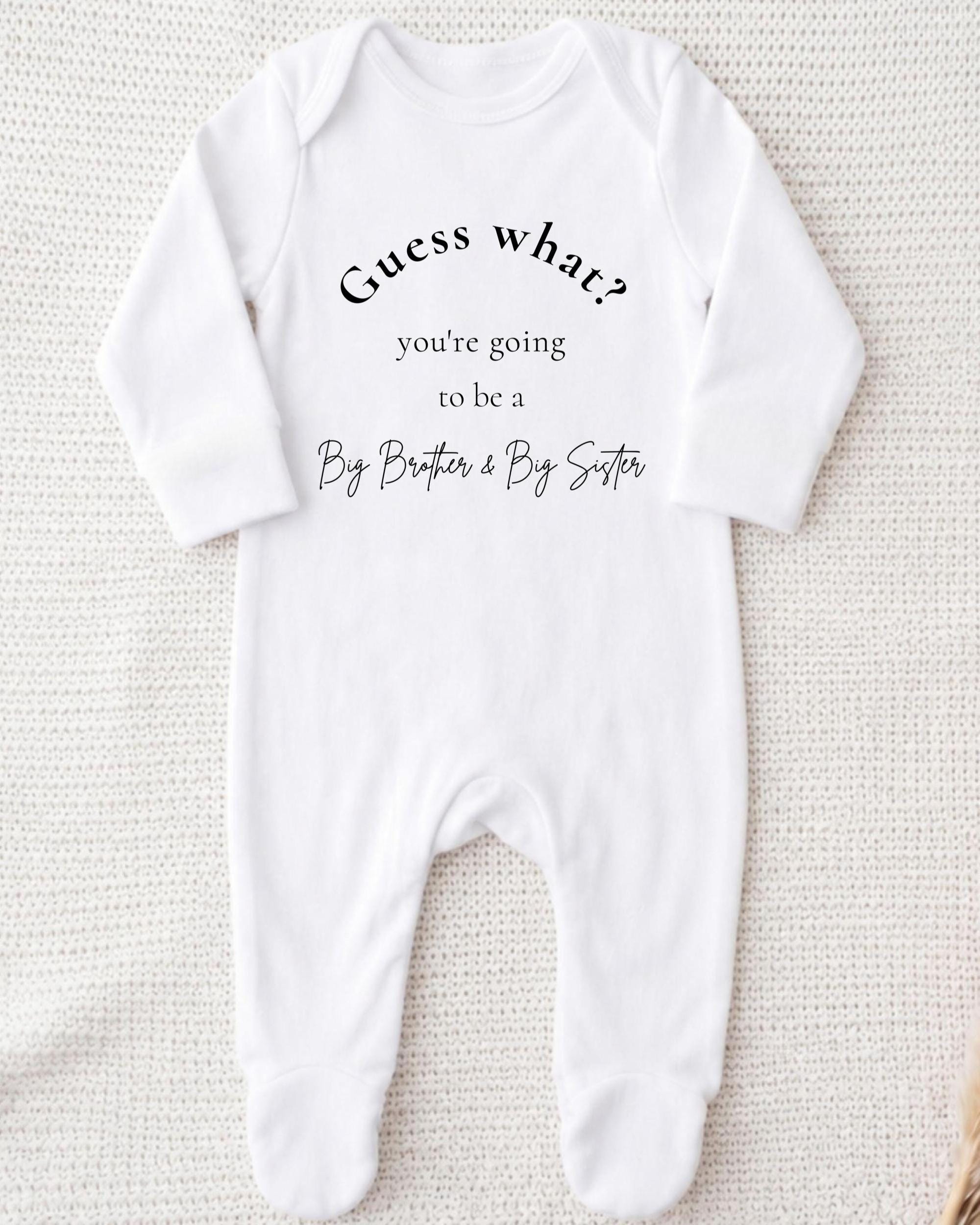 A white onesie with text on it, placed on a white background.