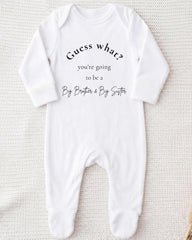 A white onesie with text on it, placed on a white background.