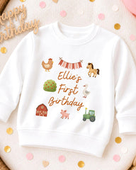 A white sweatshirt with a birthday message printed on it, surrounded by confetti.