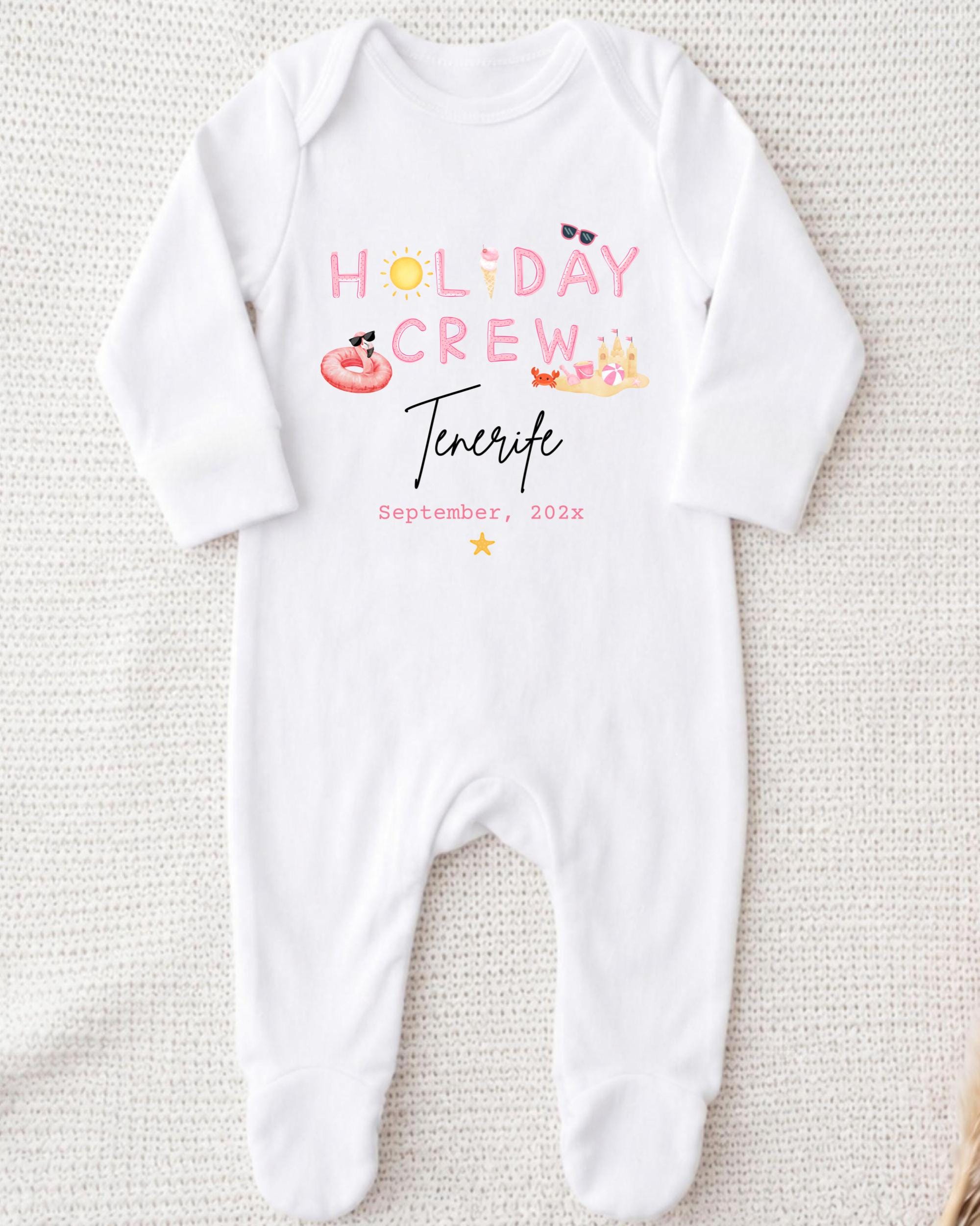 A white onesie with the text "HOLIDAY CREW Tenerife September 2023" printed on it.
