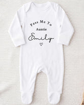 A white onesie with the text "Pass Me To Auntie Emily" printed on it.
