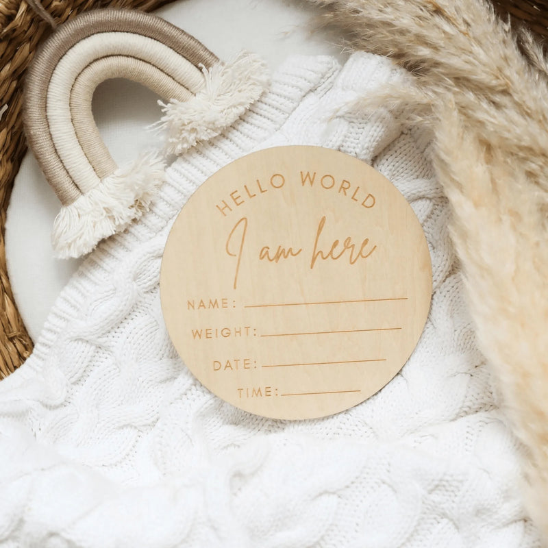 a personalized wooden ornament on a white sweater