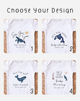 Four personalisable white Baby Vest designs with black 'Sea You Soon' lettering, baby names and dates, plus ocean graphics including whales, a dolphin and a lighthouse.