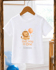 A white t-shirt with a cartoon lion holding a balloon and the text "Half Way to One Simba" printed on it.