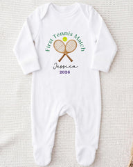 A white onesie with a tennis racket and ball design, along with the text "First Tennis Match Jessica 2016".