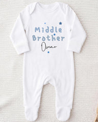 A white onesie with the text "Middle Brother Oscar" printed on it.
