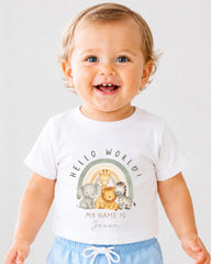 A smiling baby wearing a white t-shirt with a graphic of animals and the text "Hello World! My name is Jason" printed on it.