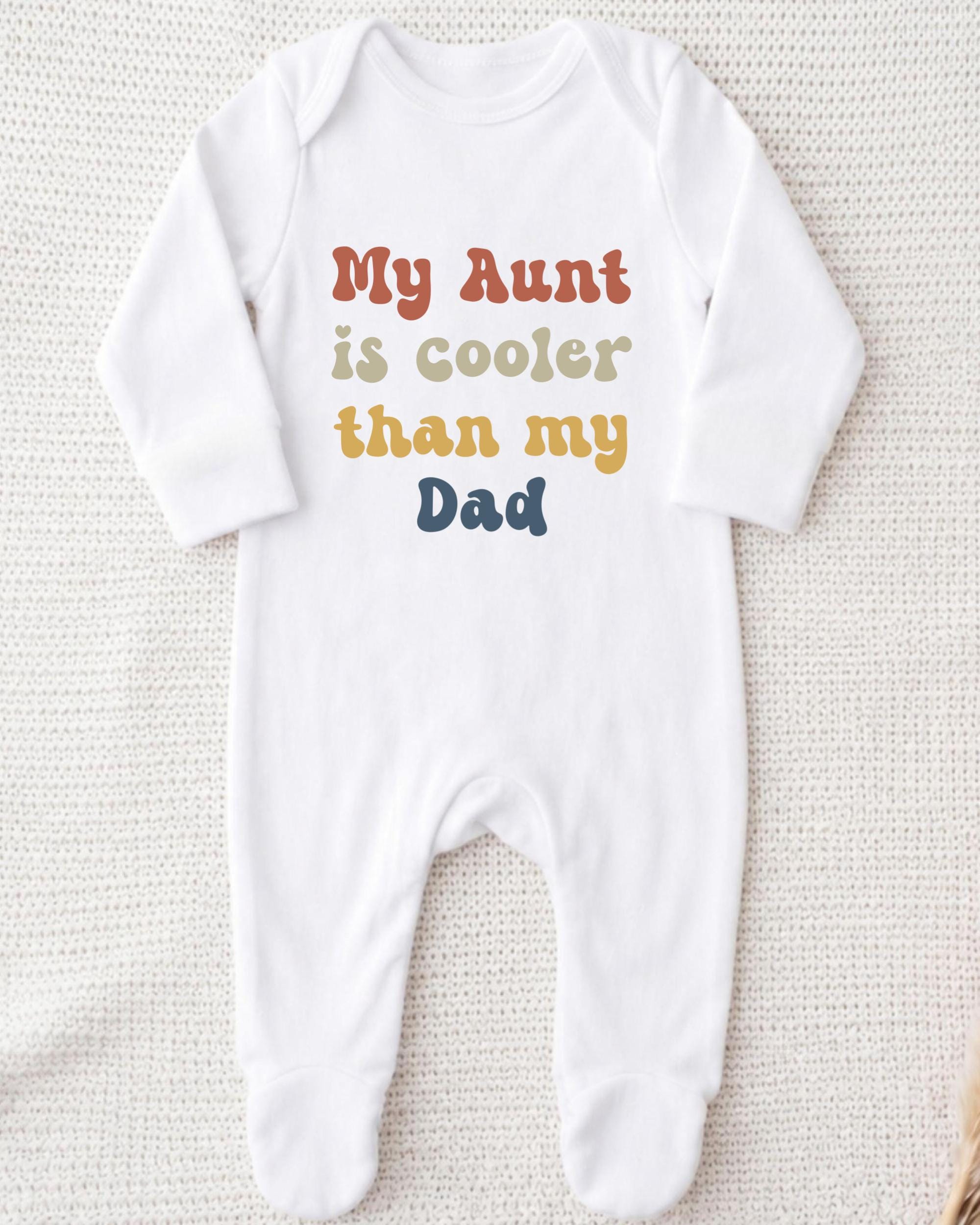 A white onesie with text printed on it.