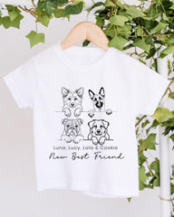 A white t-shirt with a graphic design featuring four cartoon dog illustrations and the text "New Best Friend" below them.