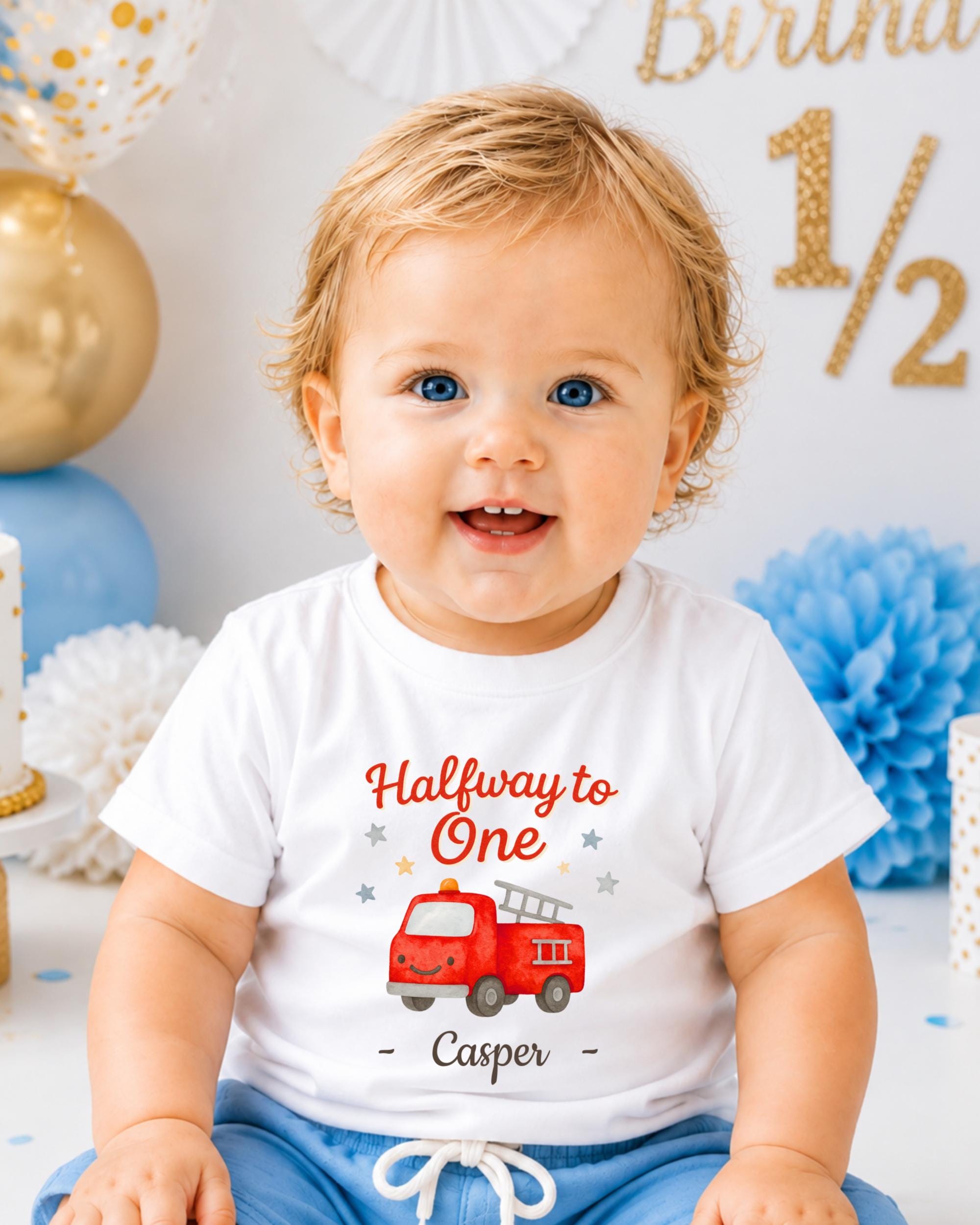 A smiling baby boy wearing a white t-shirt with a red fire truck graphic and the text "Halfway to One - Casper" printed on it.