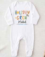 A white onesie with the text "HOLIDAY CREW Madrid September 202x" printed on it.