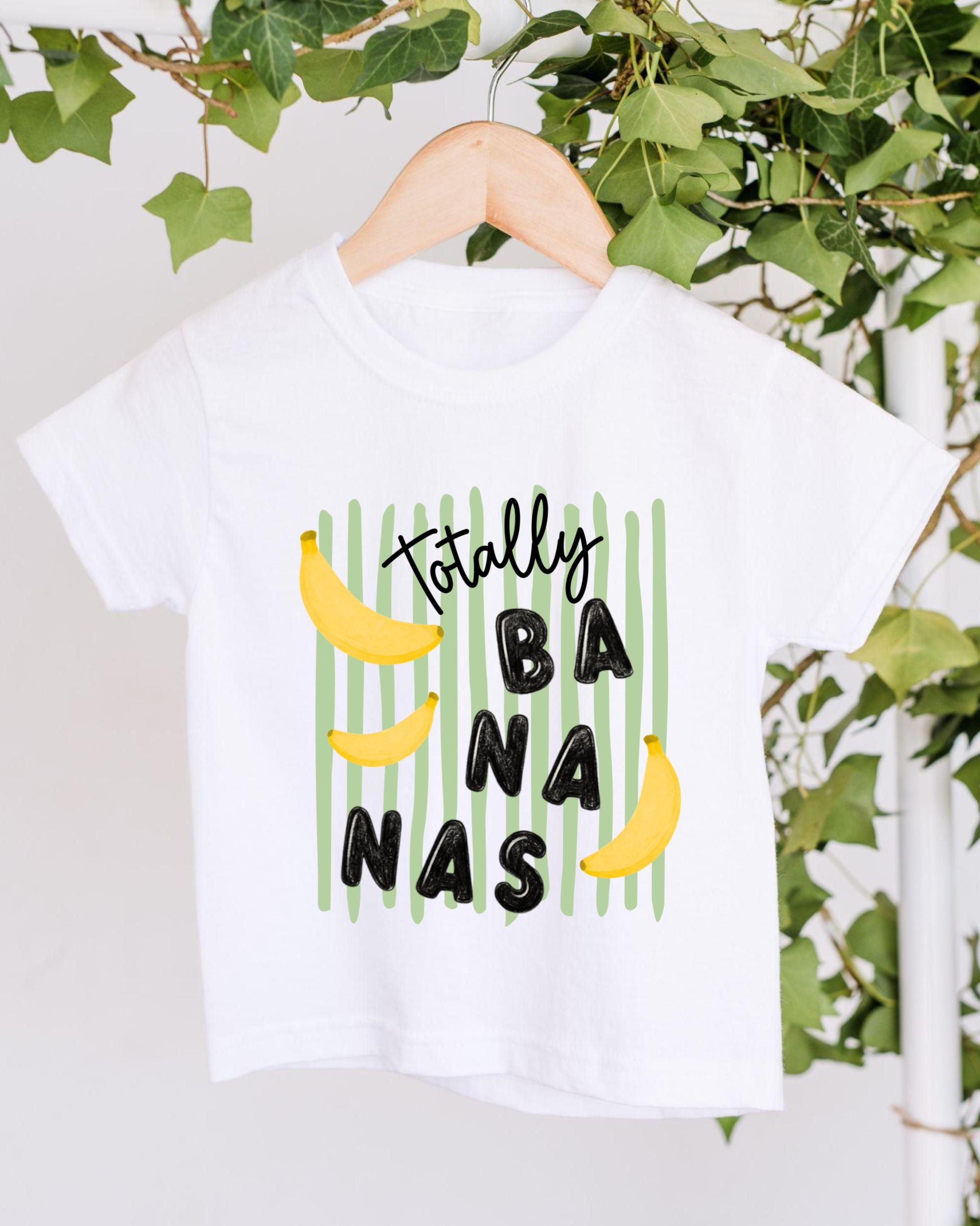 A white t-shirt with a graphic design featuring bananas and the text "Totally Bananas" printed on it.