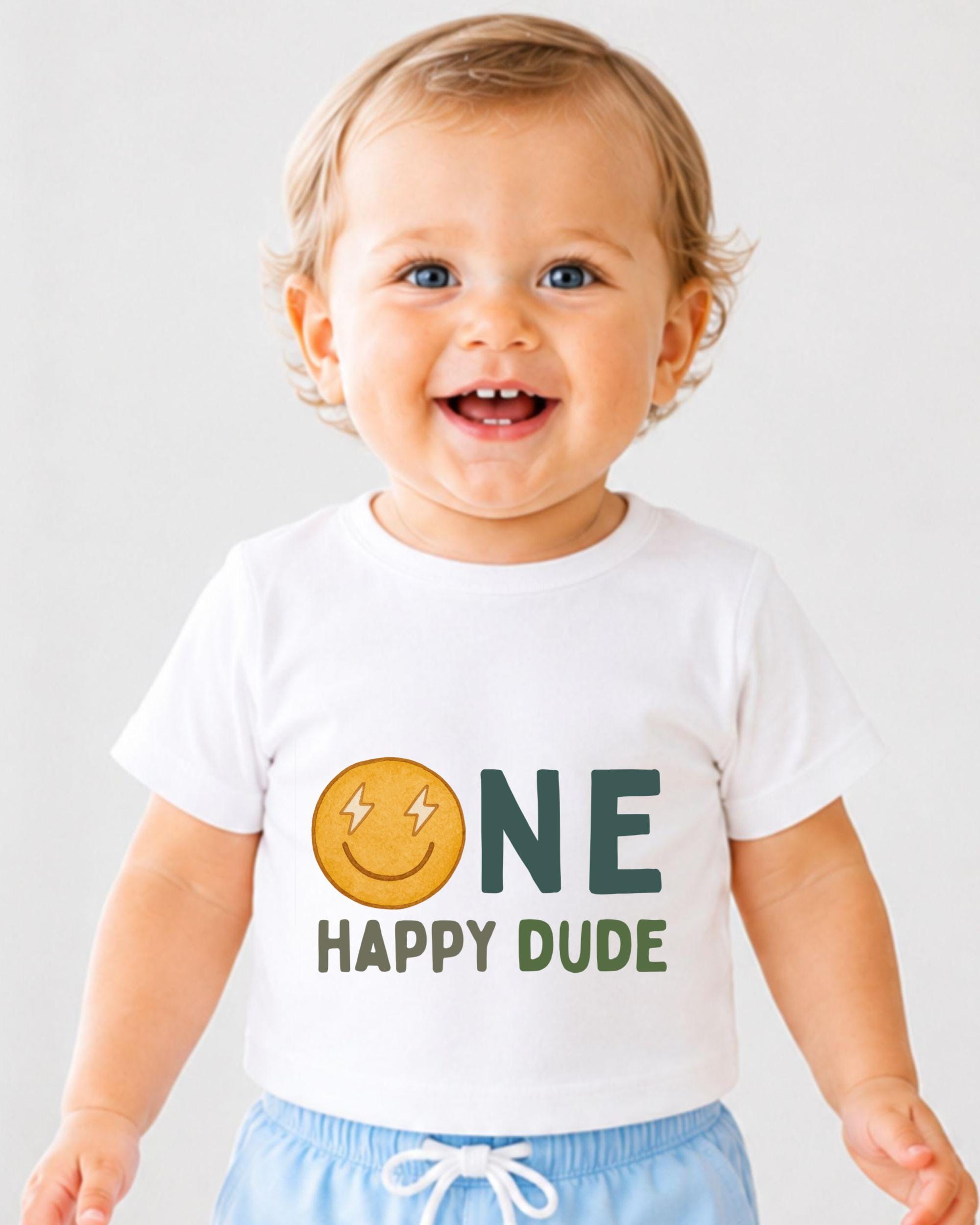 A smiling baby boy wearing a white t-shirt with a smiley face and the text "ONE HAPPY Dude" printed on it.
