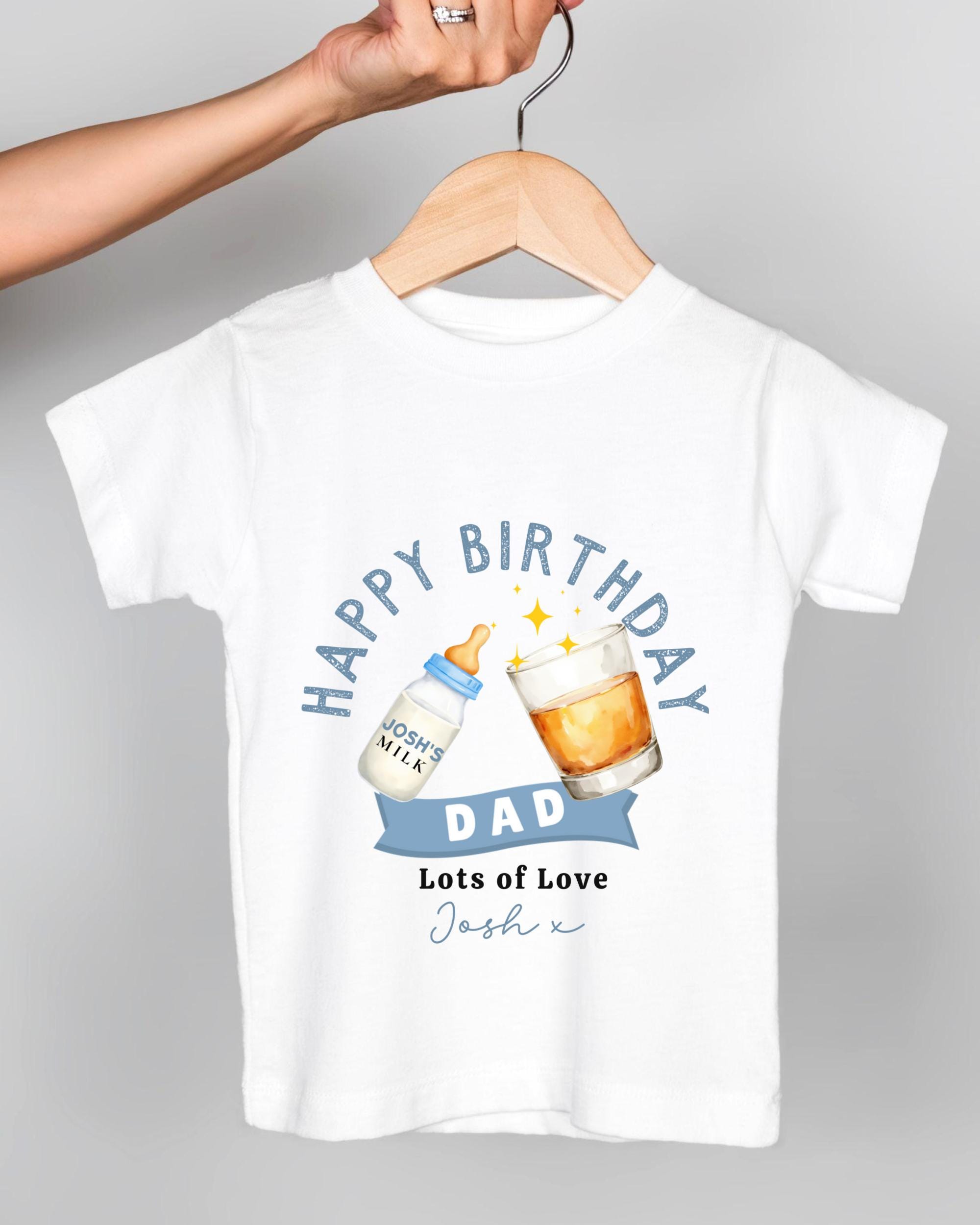 A white t-shirt with a graphic design that says "Happy Birthday Dad Lots of Love Josh x" and features a bottle of milk and a glass of beer.