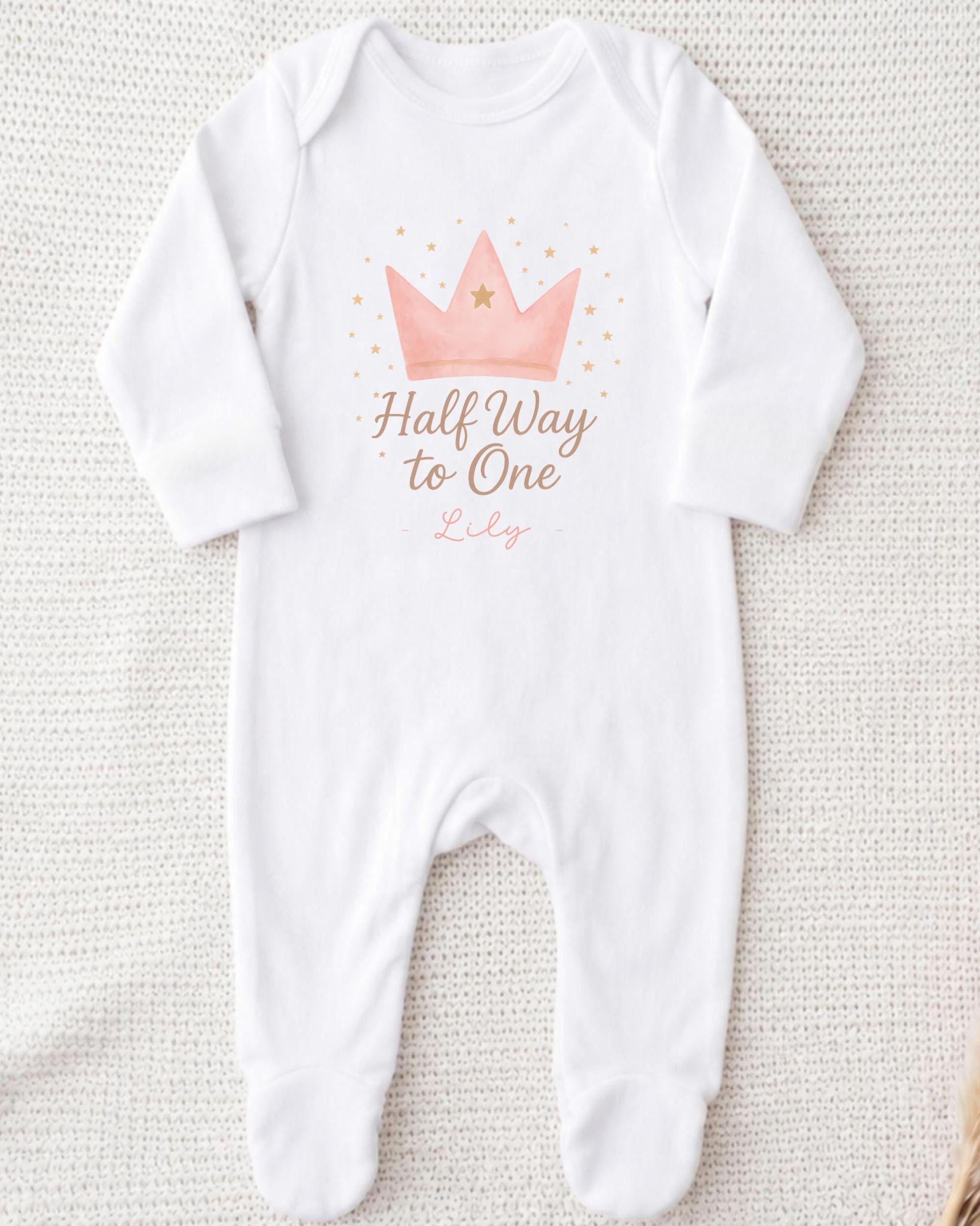 A white onesie with a crown and the text "Half Way to One" printed on it.