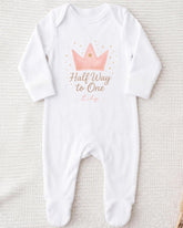 A white onesie with a crown and the text "Half Way to One" printed on it.