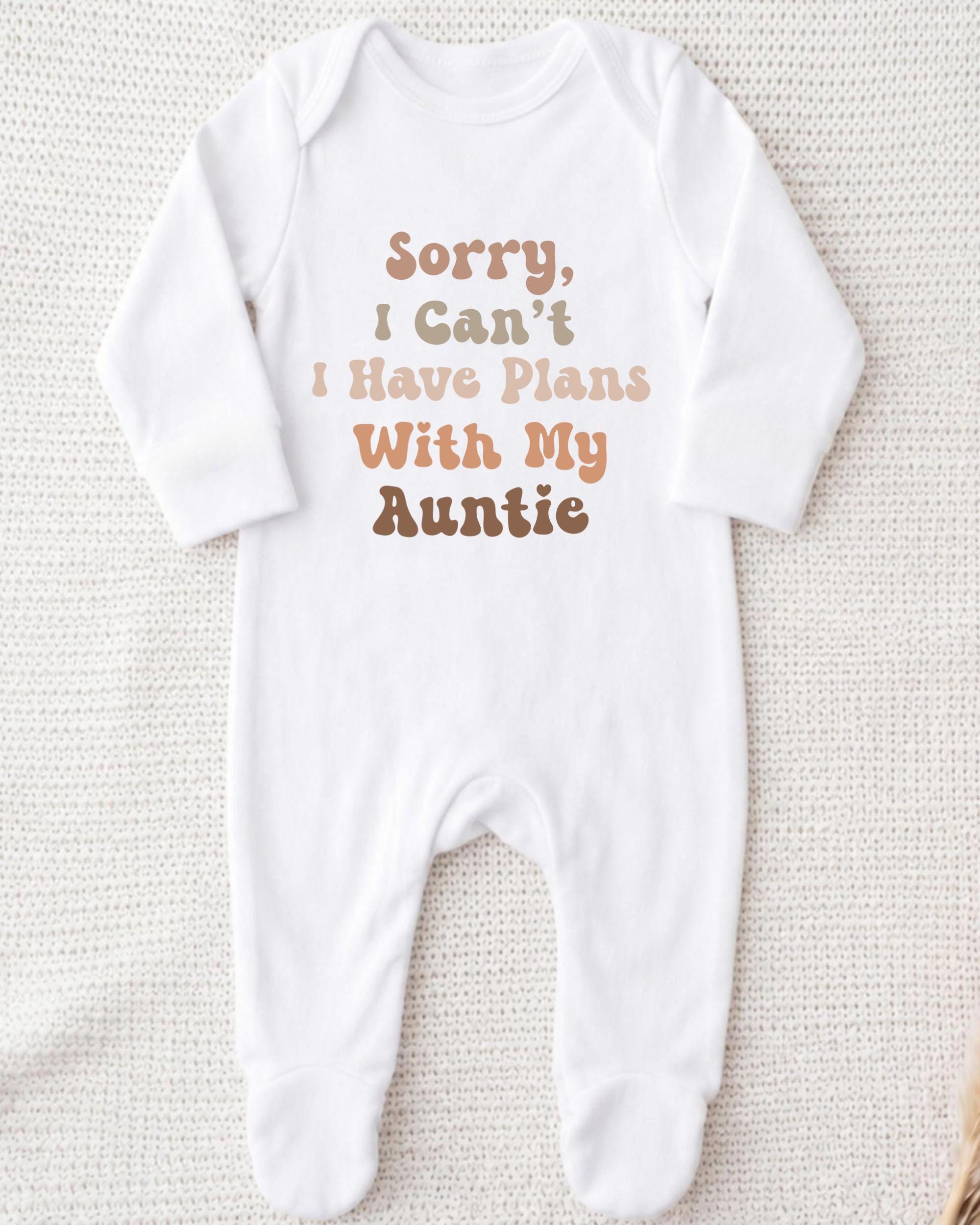 A white onesie with text printed on it.