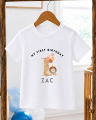 A white t-shirt with a personalized birthday message and a cartoon image of a lion.