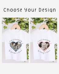 two white t-shirts with heart-shaped designs and text printed on them. The text on the t-shirts reads "Loved & Protected by my Grandpa in Heaven" and "Loved & Protected by my Daddie in Heaven".