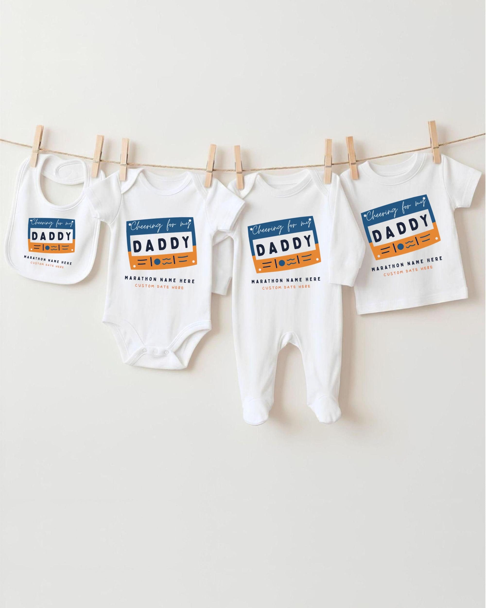 a collection of baby clothes, including onesies and bibs, hanging on a clothesline.
