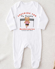 A white onesie with a teddy bear and a running bear printed on it, along with the text "Cheering for My Mummy" and "Marathon name here Custom date here".