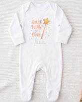 A white onesie with a printed text and a star graphic on it.