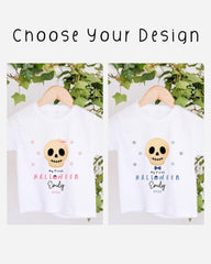two white t-shirts with Halloween-themed designs, featuring skull images and text. The text on the t-shirts reads "My first Halloween Emily 202".