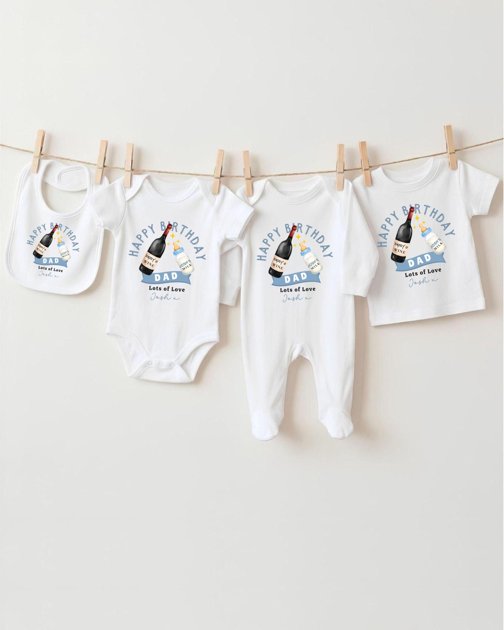 A collection of white baby clothes, including onesies and bibs, hanging on a clothesline.