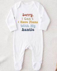 A white onesie with text printed on it.
