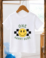 A white t-shirt with a cheerful smiley face and the text "ONE HAPPY Dude" printed on it, hanging on a wooden hanger.