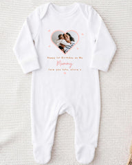 A white onesie with a photo of a mother and child inside a heart shape, along with the text "Happy 1st Birthday as My Mummy, love you late, Olivia x".