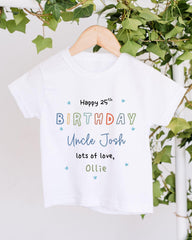 A white t-shirt with colorful text and a personalized message for Uncle Josh's 25th birthday.