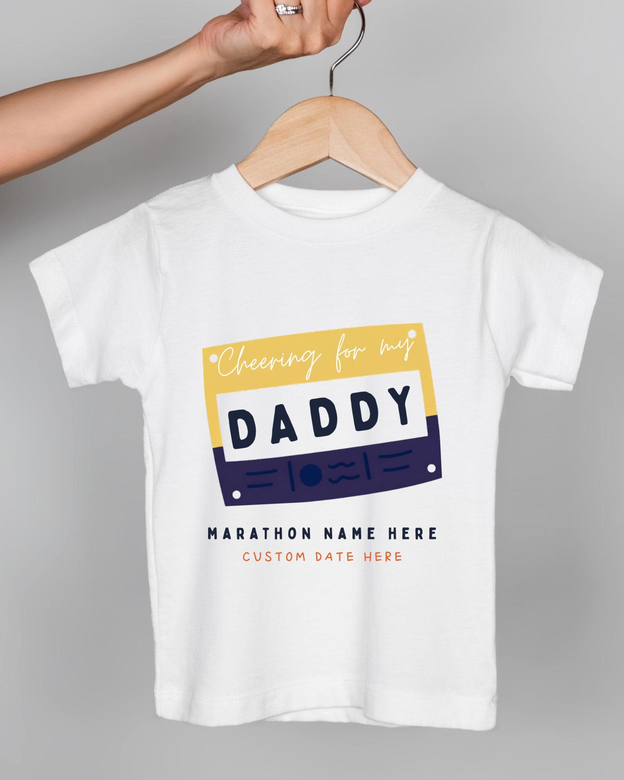 A white t-shirt with a graphic design featuring the text "Cheering for my DADDY" and "Marathon Name Here Custom Date Here" printed on it.