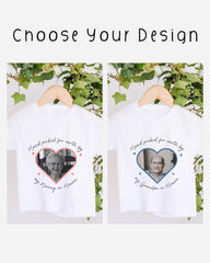 two white t-shirts with heart-shaped designs featuring portraits of elderly individuals. The text on the t-shirts reads "Hand picked for earth by my Grandpa in Heaven".