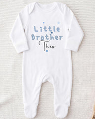 A white onesie with the text "Little Brother Theo" printed on it.