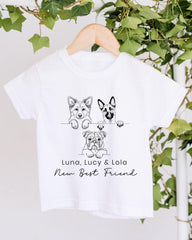 A white t-shirt with a graphic design featuring three cartoon dog illustrations and the text "Luna, Lucy & Lola New Best Friend".