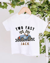 A white t-shirt with a graphic design of a race car and the text "Two Fast Jack" printed on it.