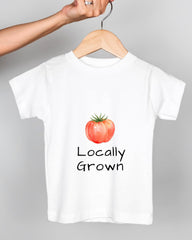 A white t-shirt with a printed design of a tomato and the text "Locally Grown" printed on it.