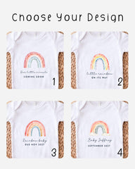 four different baby t-shirts with a rainbow design, each with a unique message related to the upcoming arrival of a baby.