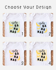 four different designs of white t-shirts with the text "Totally BANANA NAS" printed on them.
